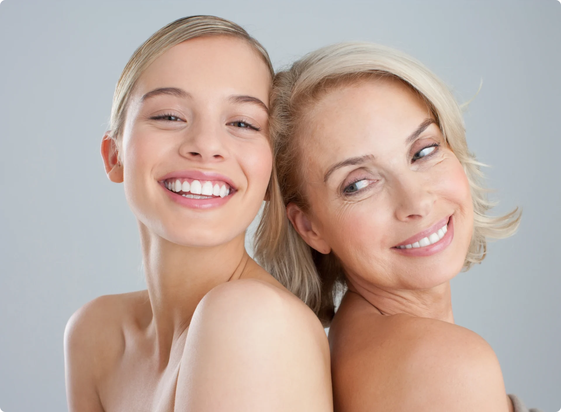 Mother and daughter smiling together
